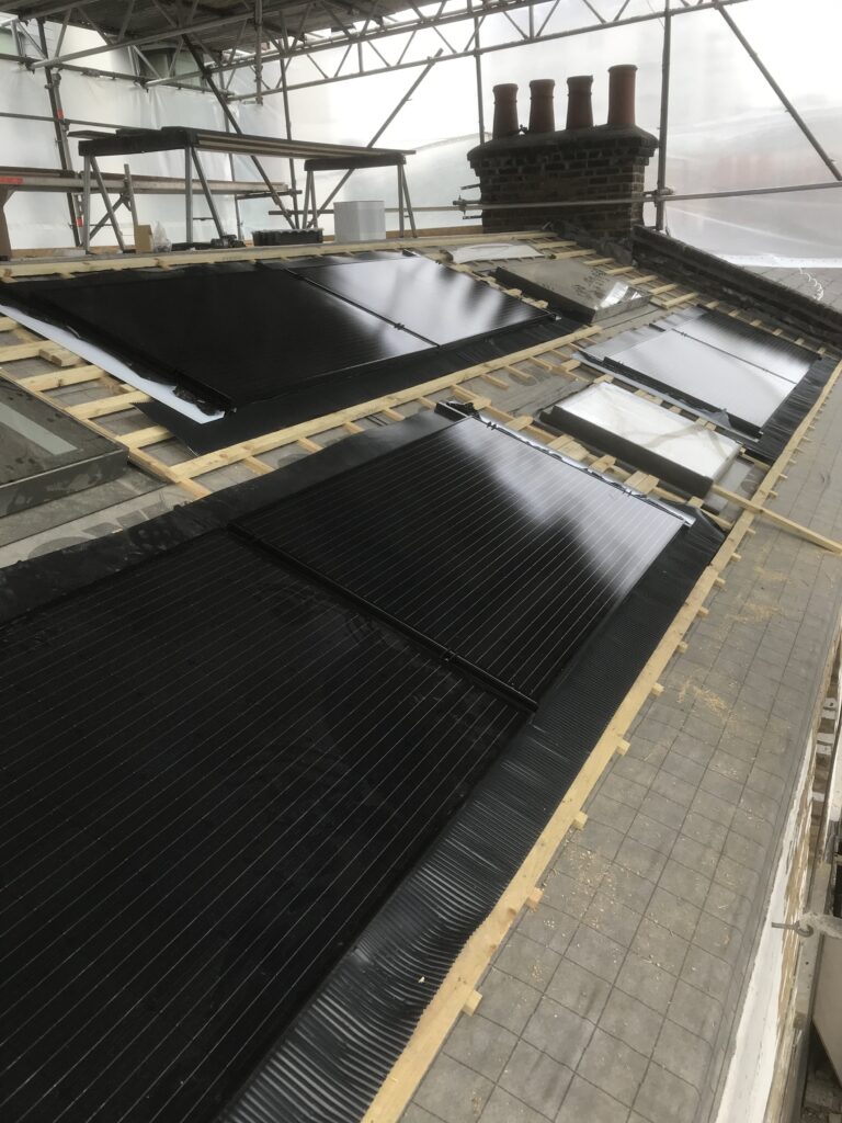 Solar panels being installed on the roof