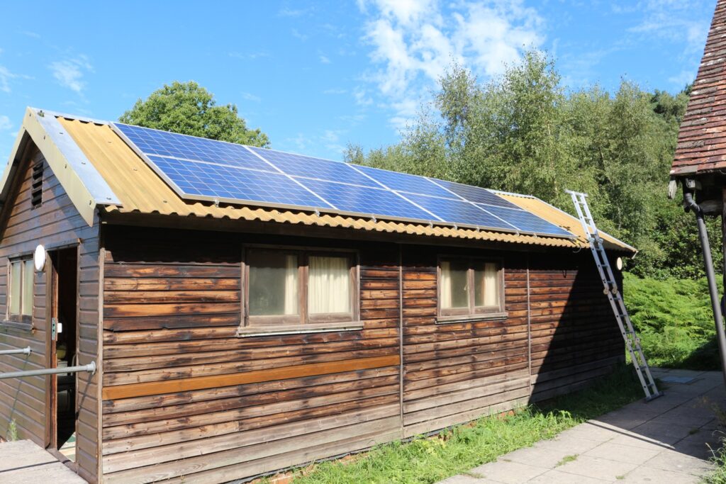 Solar PV installed on the hut with a ladder to the tin roof